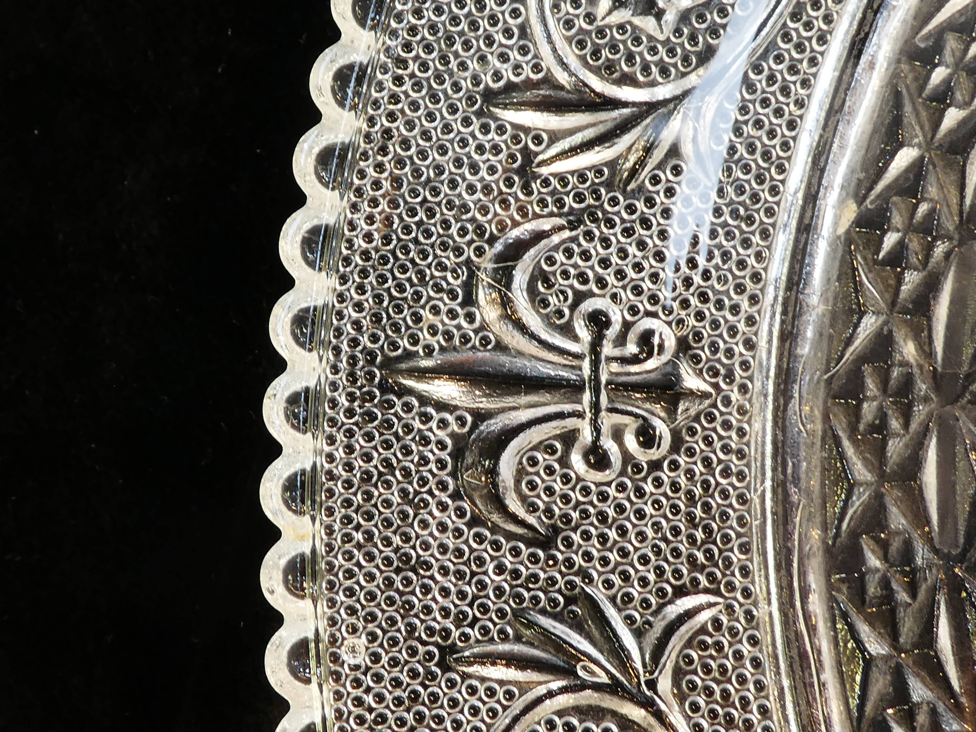 Old plate with pressed glass arabesque pie