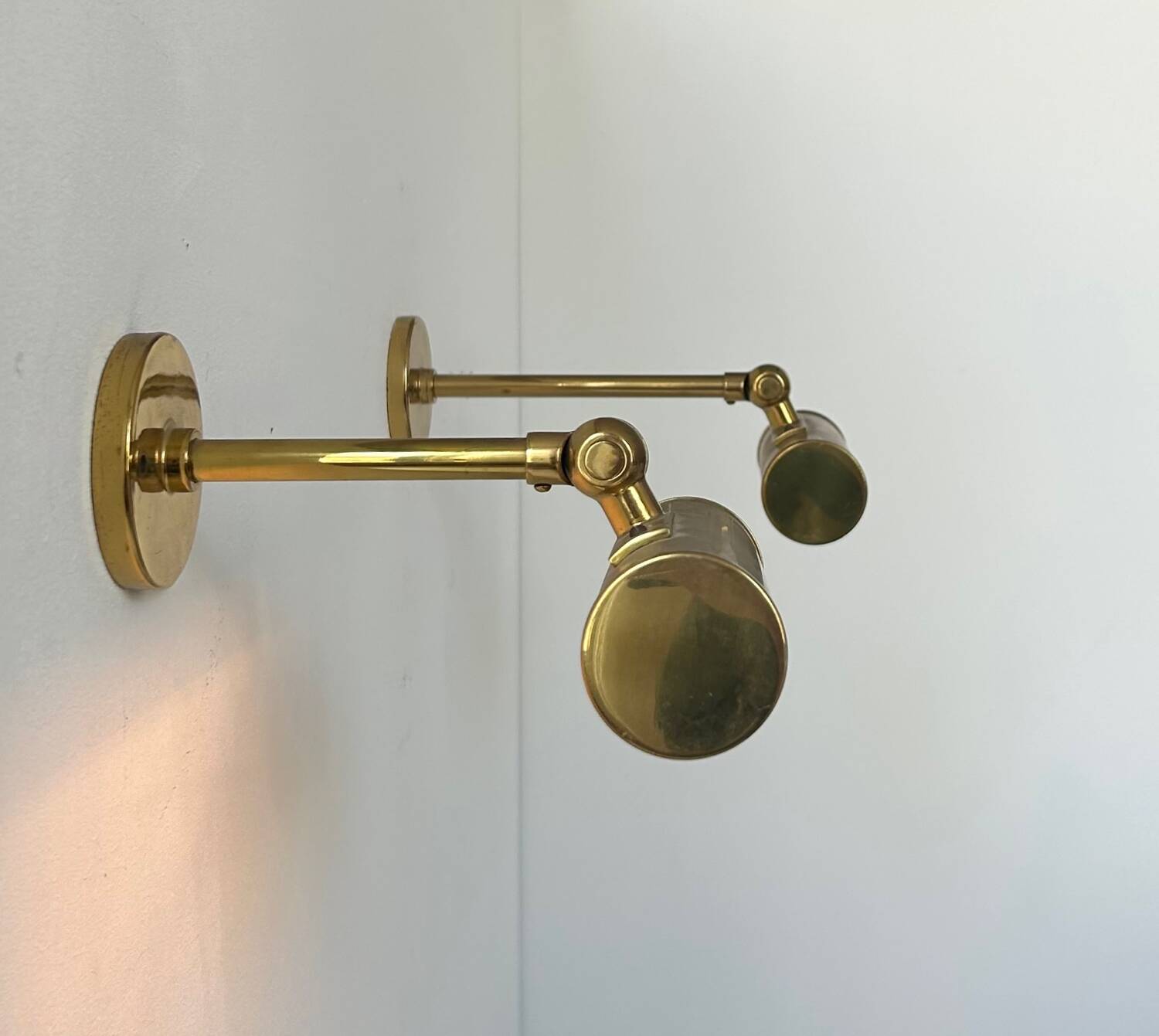 Pair of vintage adjustable wall lights, solid brass, France 1950