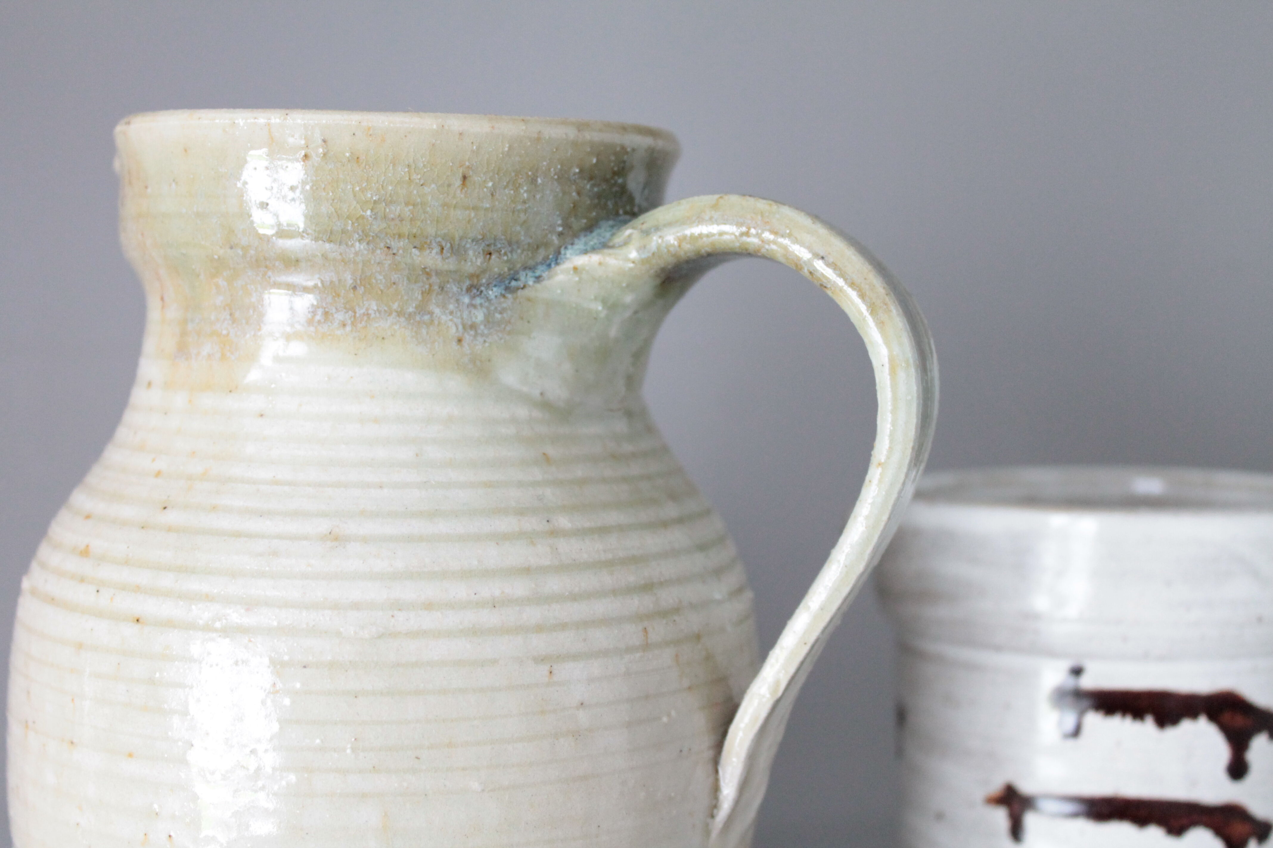 Old decanter in enamelled sandstone