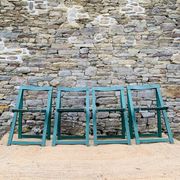Set of 4 green folding chairs