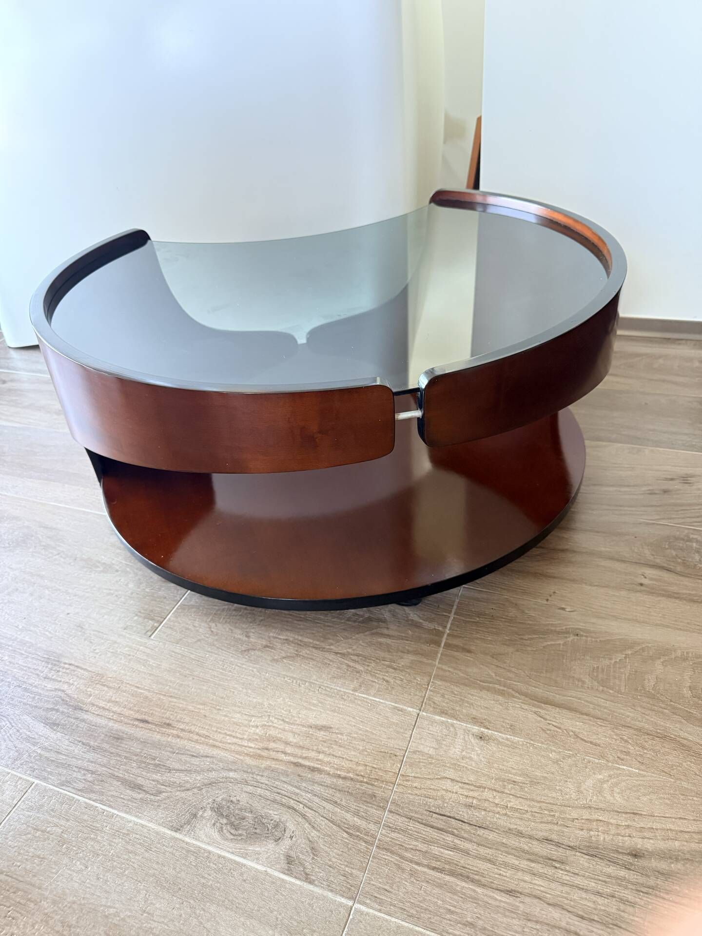 Italian Space Age coffee table in curved wood and smoked glass – 1970s