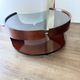 Italian Space Age coffee table in curved wood and smoked glass – 1970s