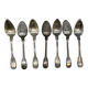 Set of 7 silver-plated dessert spoons with a bi-lobed filet pattern.