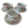 Trio of floral porcelain cups and saucers