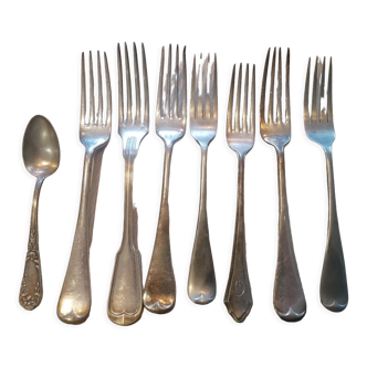 Set of 7 forks and 1 spoon in silver metal