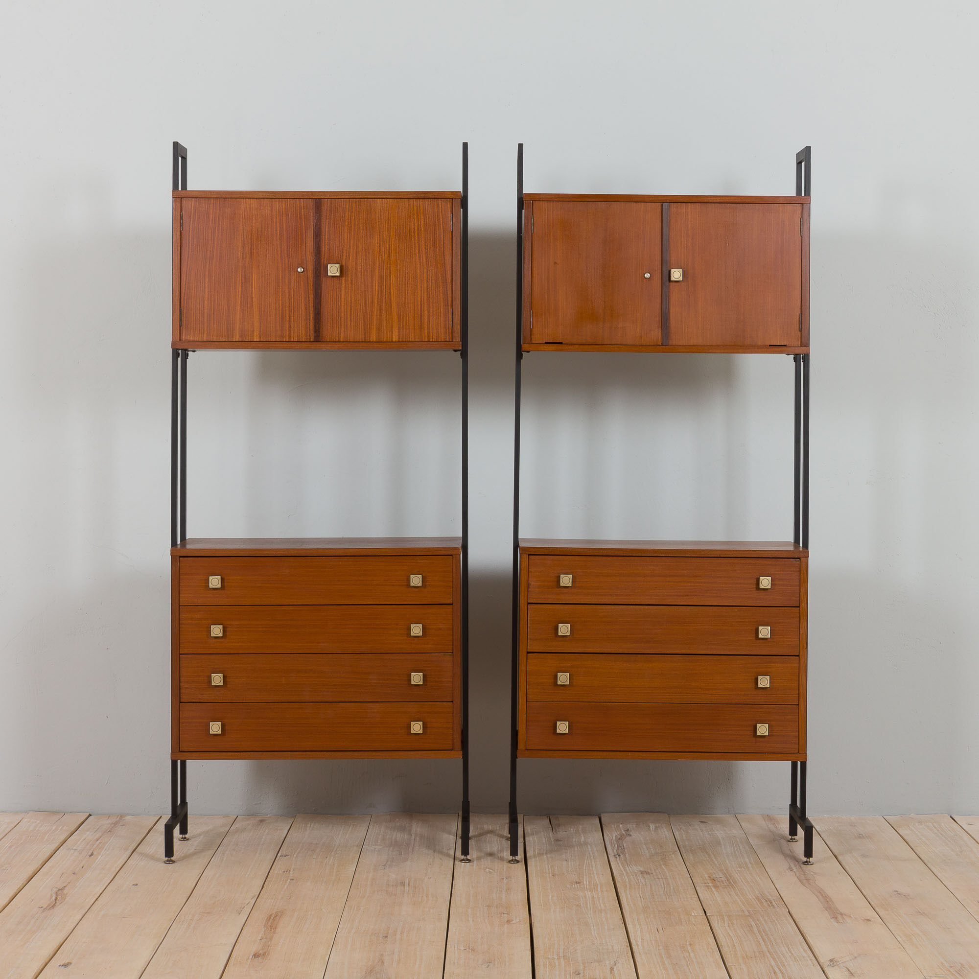 Pair of Italian mid century freestanding wall units in teak with brass handles.