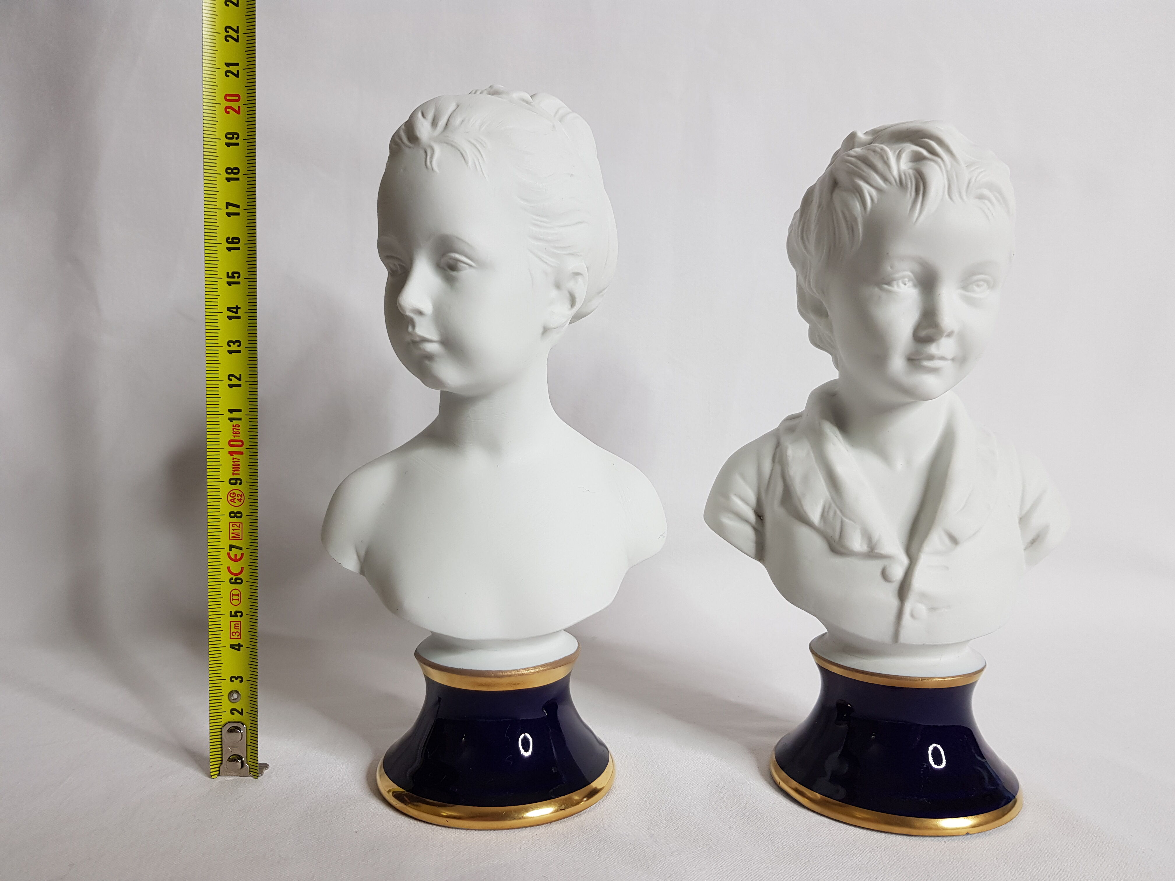 Porcelain biscuit busts by Camille Tharaud, children Louise and Alexandre Brongniart after Houdon