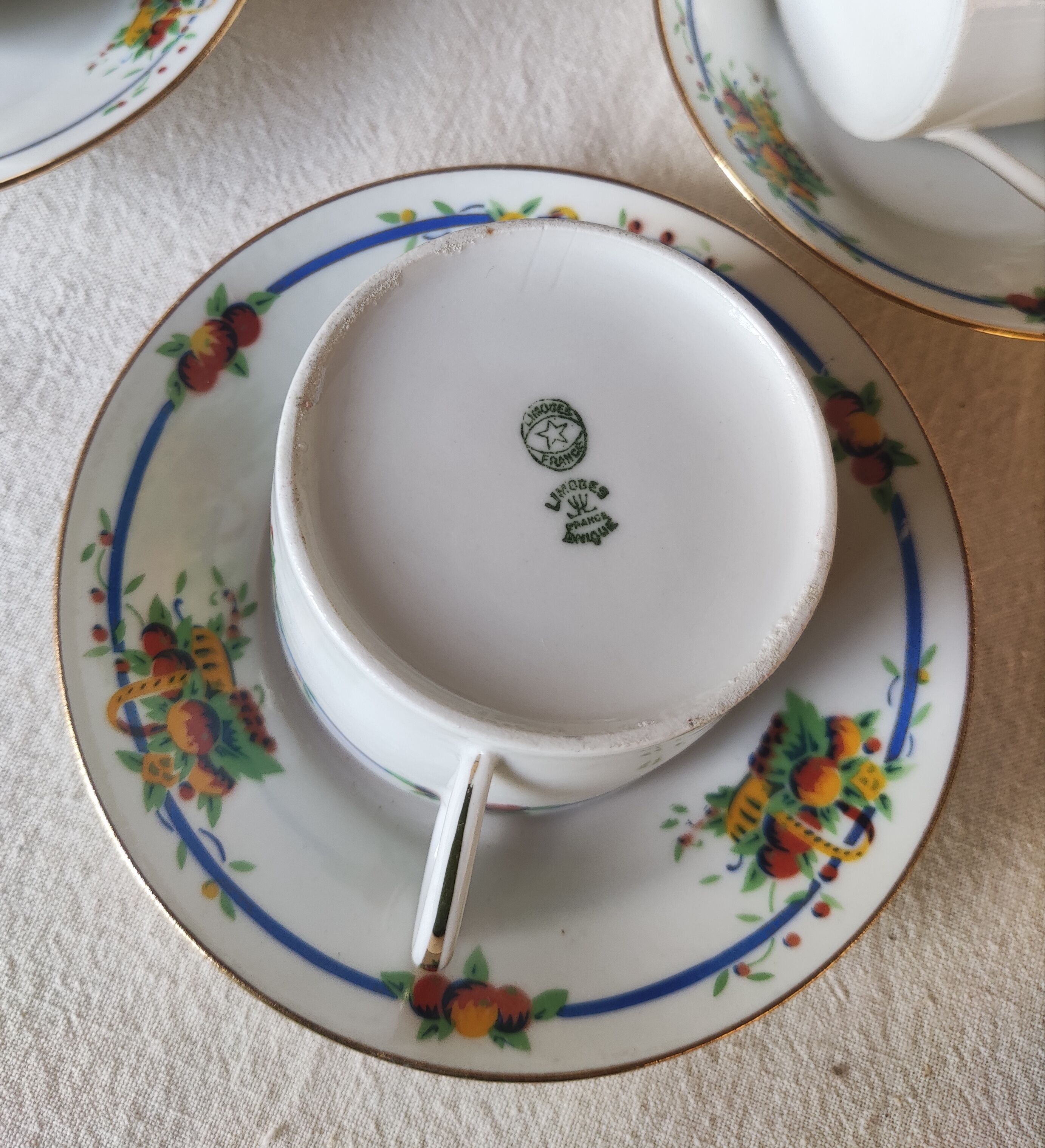 10 tea cups and creamer in Limoges porcelain