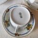10 tea cups and creamer in Limoges porcelain