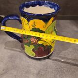 Ceramic pitcher with fruit and vine decoration - colorful rustic style
