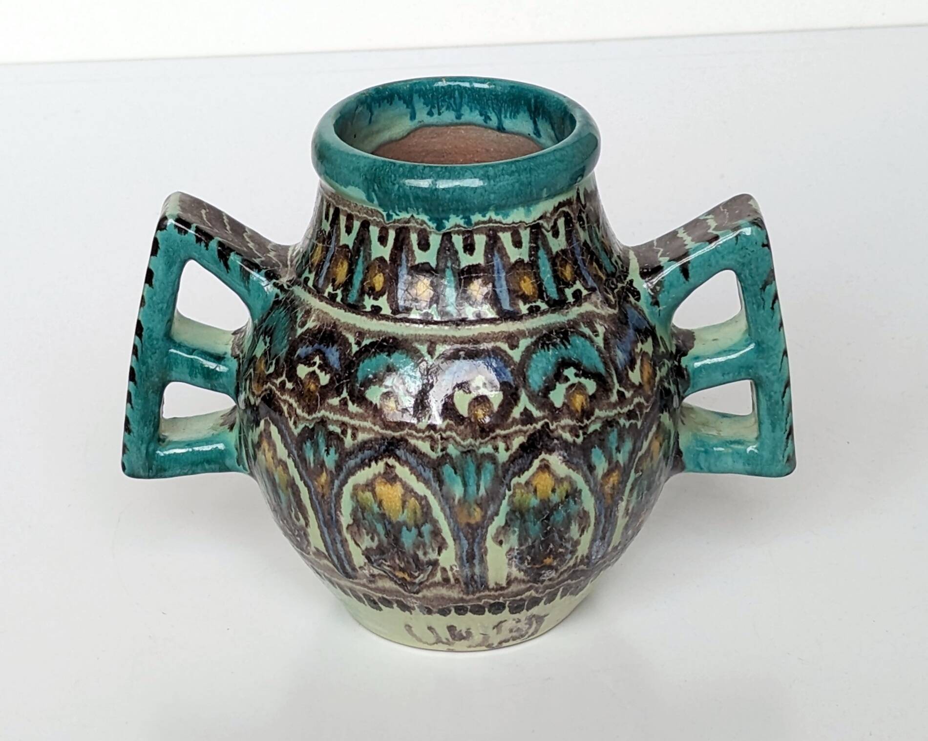 Polychrome ceramic vase in flowing enamel from Nabeul with mihrab decoration.