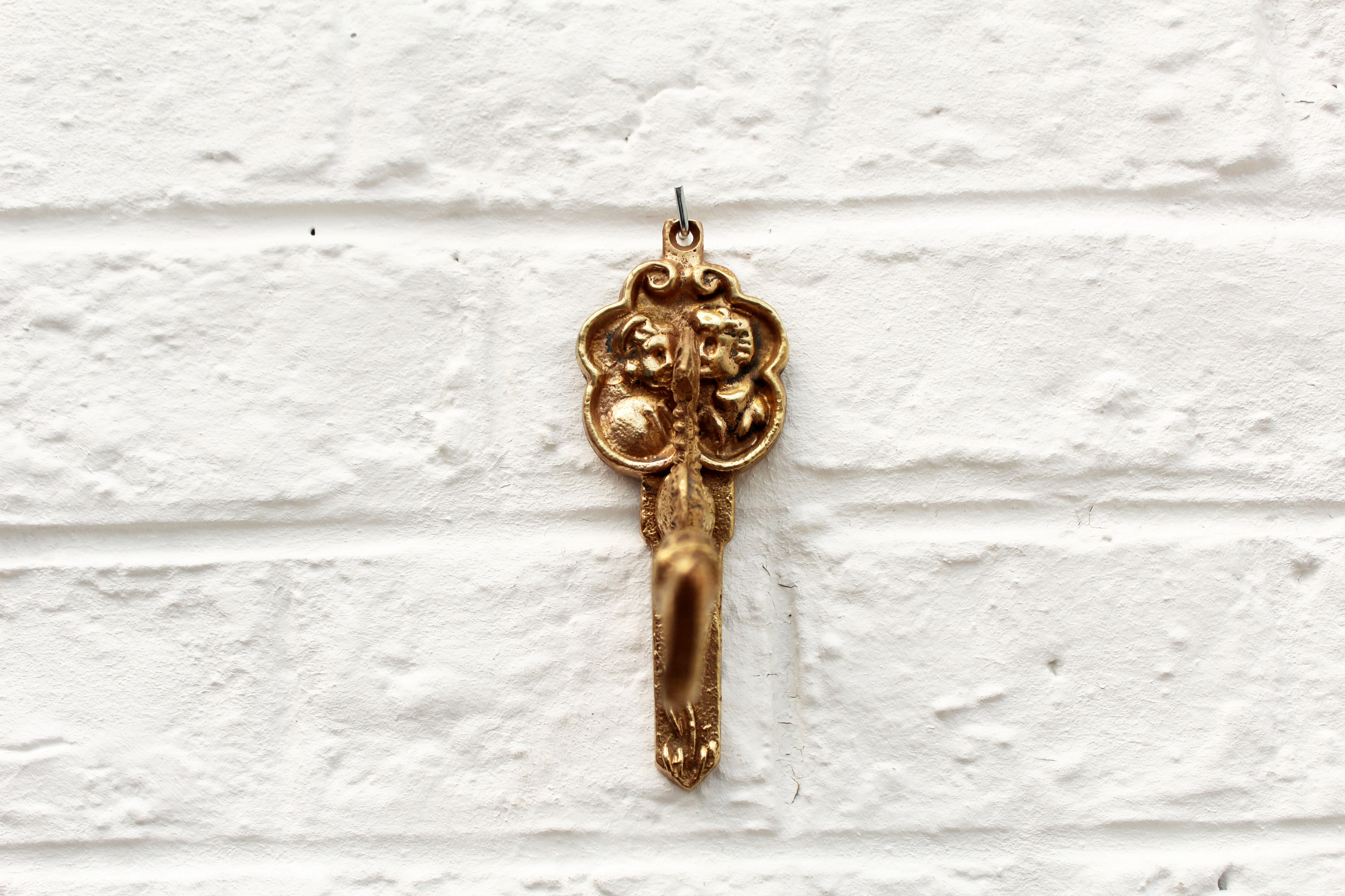 Coat hanger in rococo style, fish, dragon, dutch man and woman