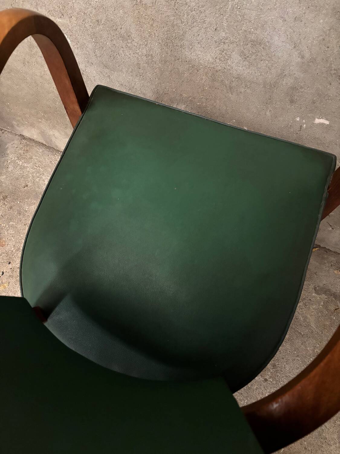 Green faux leather bridge chair