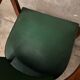 Green faux leather bridge chair