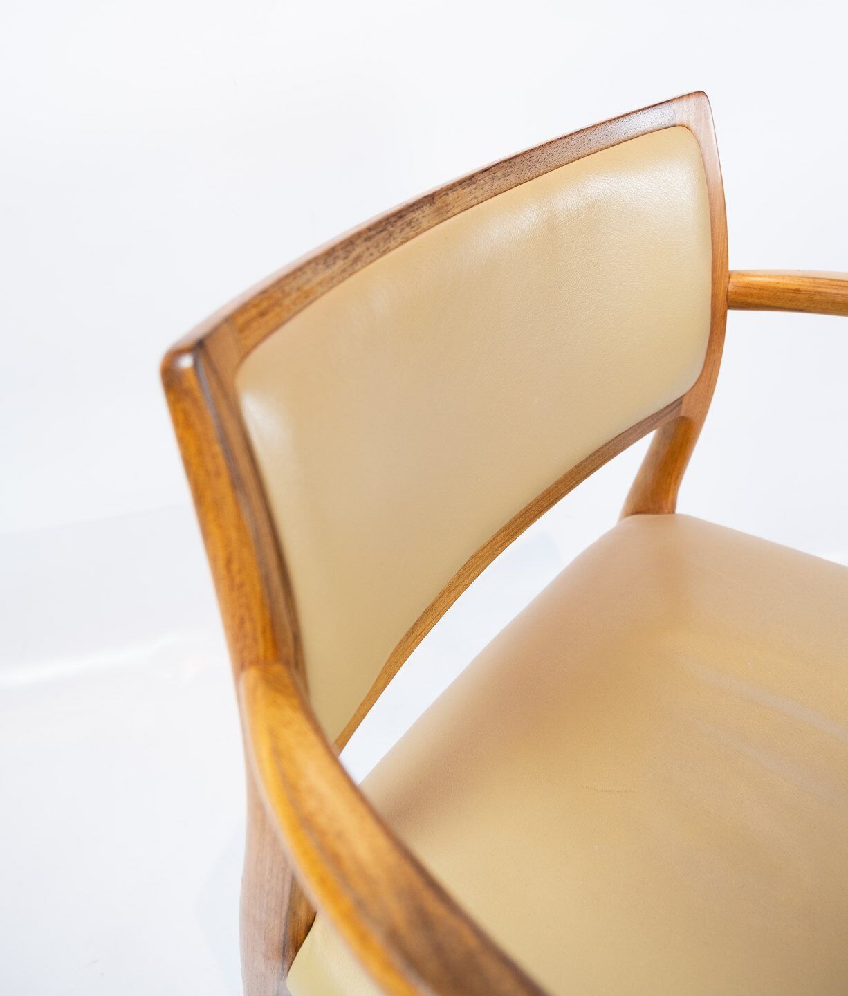 Pair of N.O. Moeller armchairs, model 65, in rosewood and light leather
