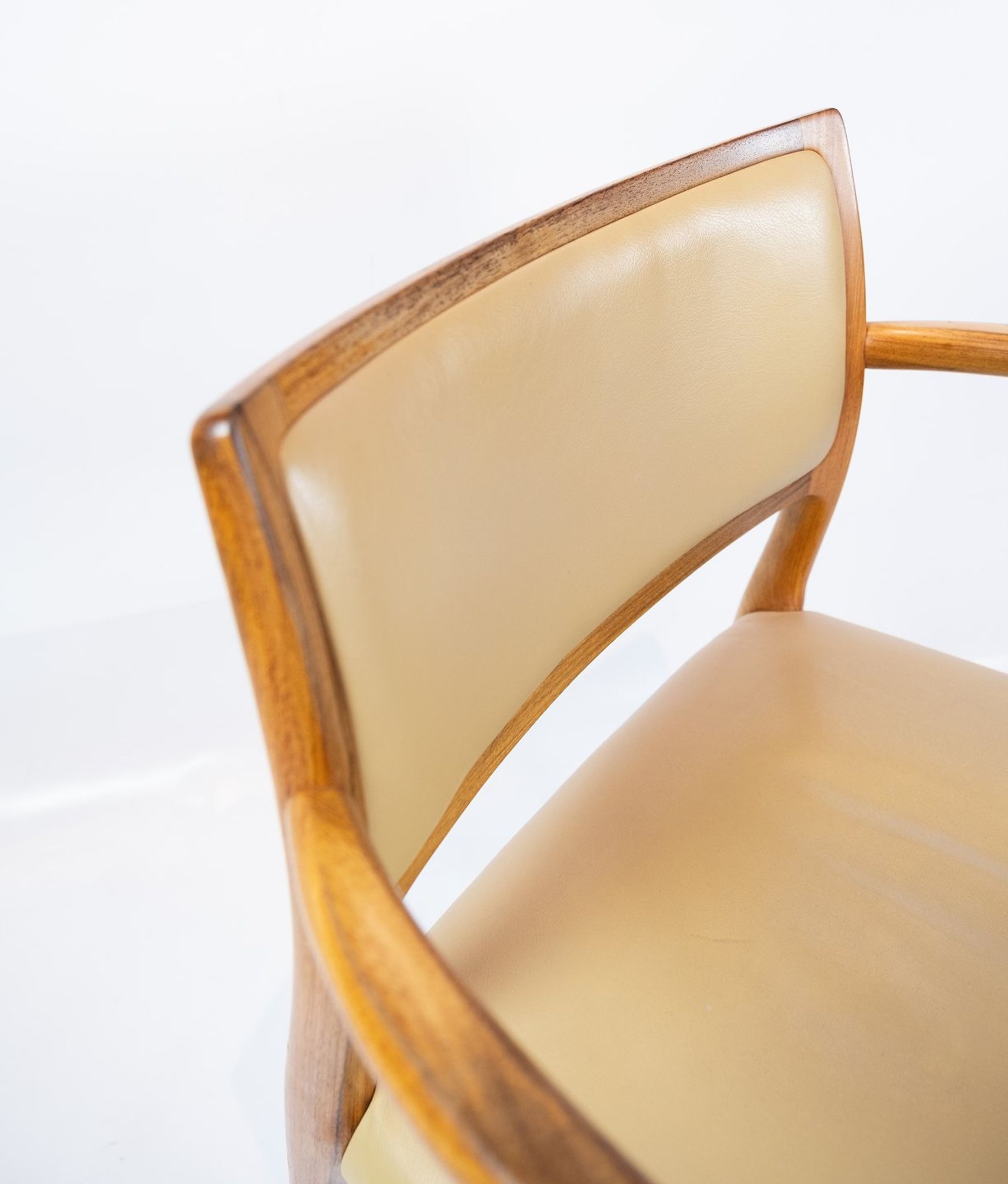 Pair of N.O. Moeller armchairs, model 65, in rosewood and light leather