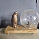 Lampe, veilleuse d'époque Art déco pingouin et globe en verre craquelé
