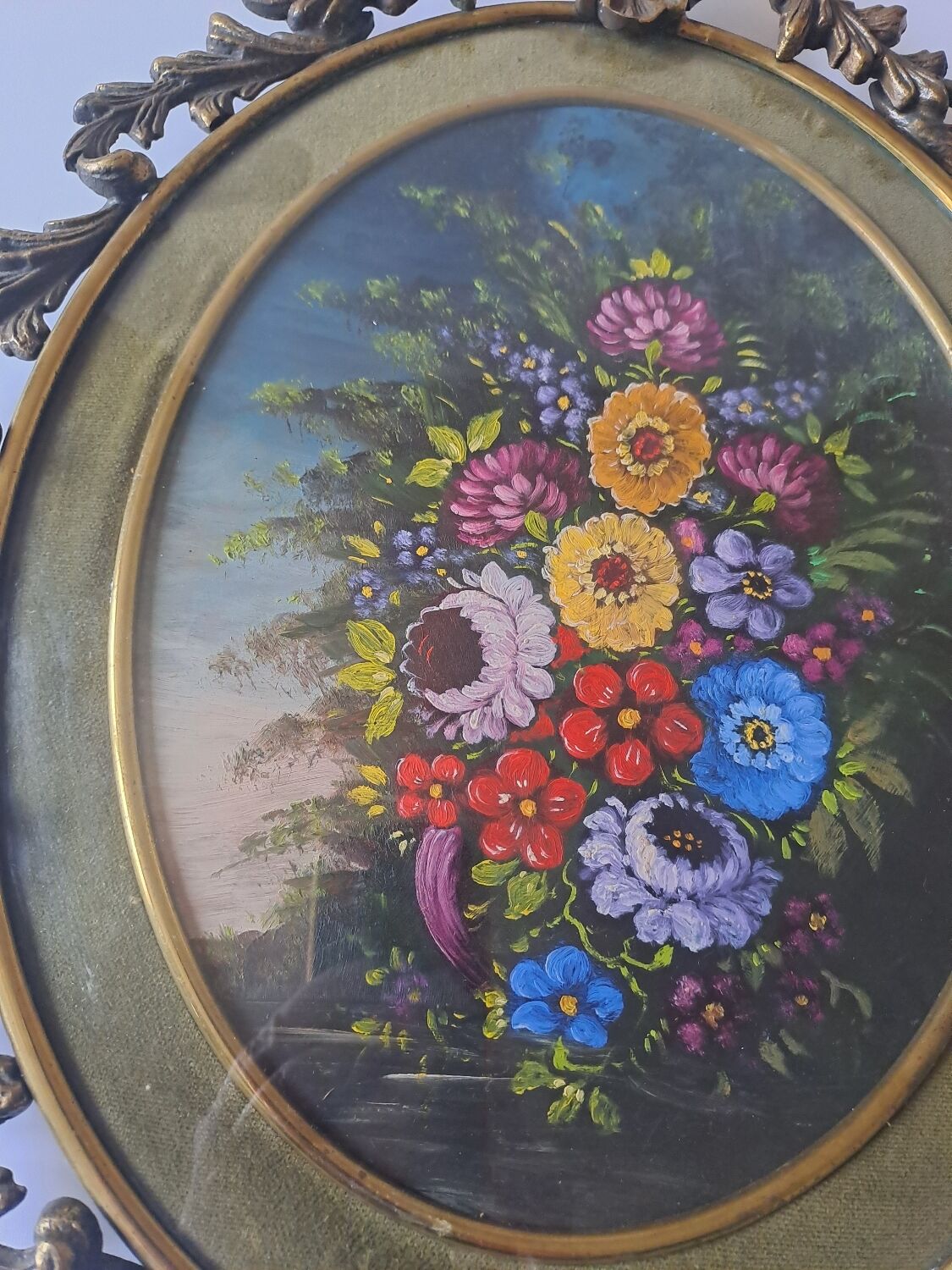 Painted under glass convex medallion in bronze