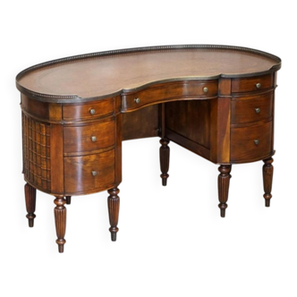 Regency style hardwood and leather kidney desk with gallery.