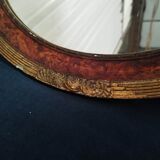 Golden oval art deco mirror