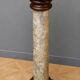 Column-shaped pedestal, made of solid wood and faux marble paint.