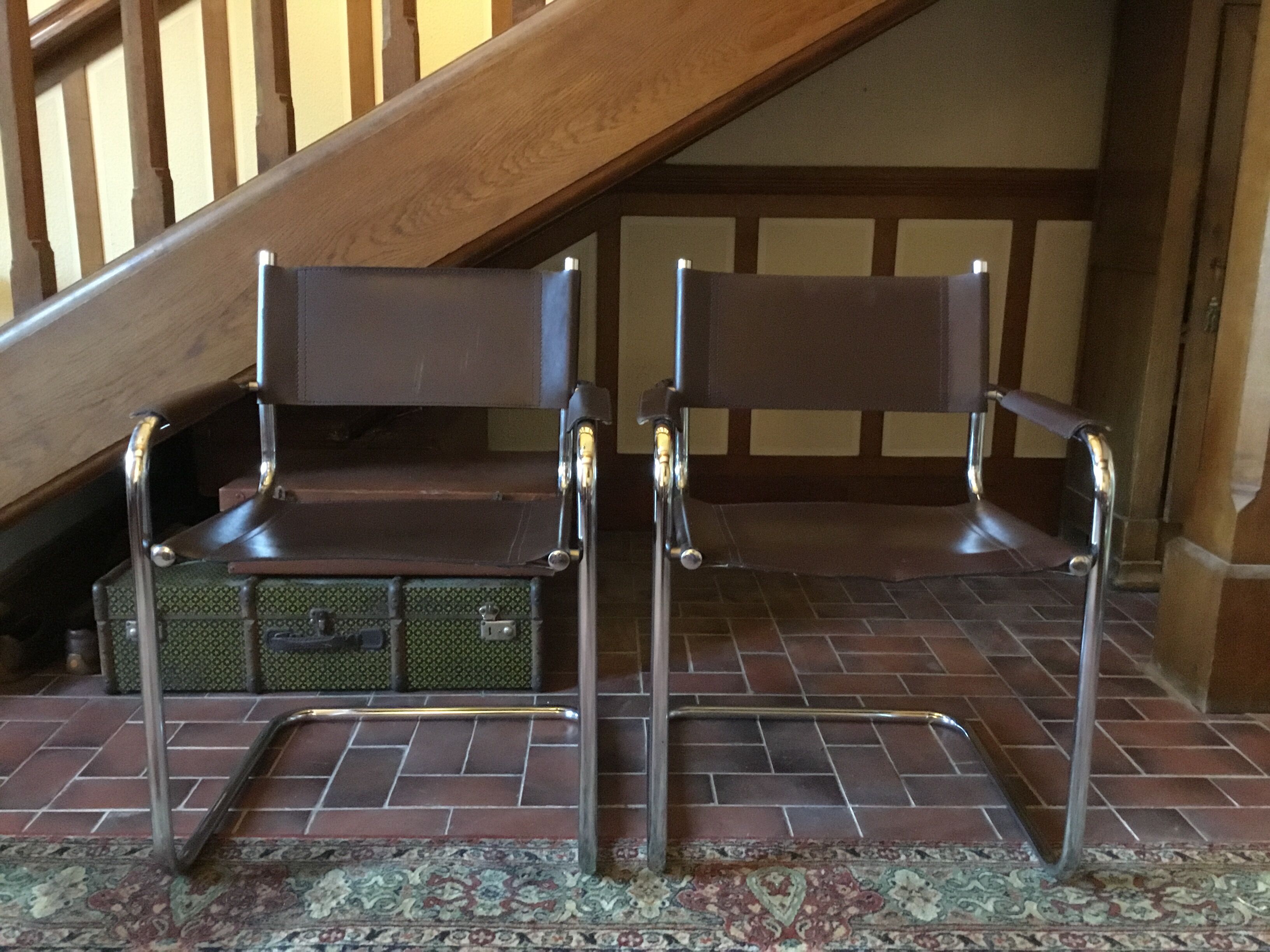 Leather and steel armchairs