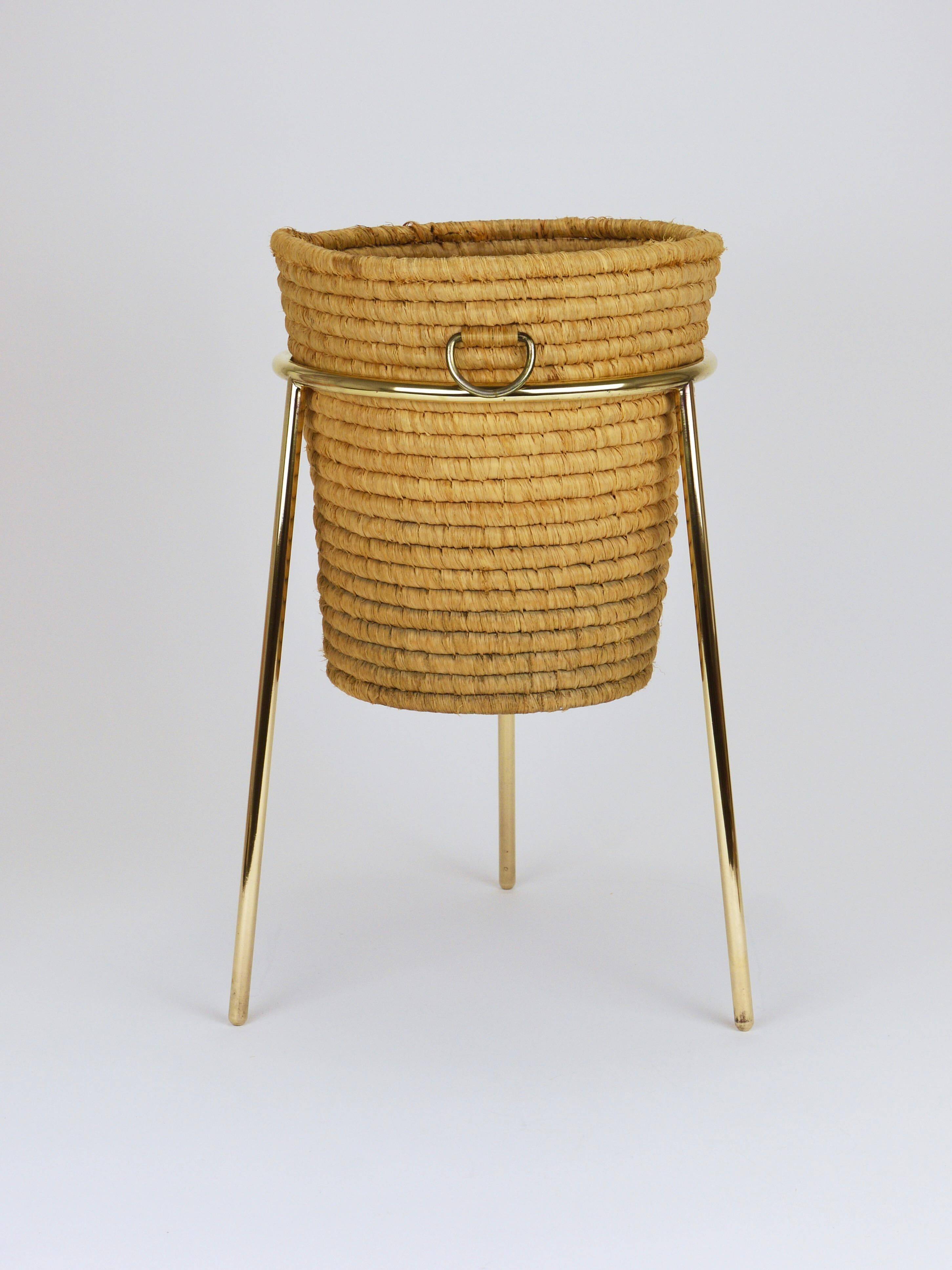Carl Auböck II paper basket in raffia and brass, umbrella stand, 1950s