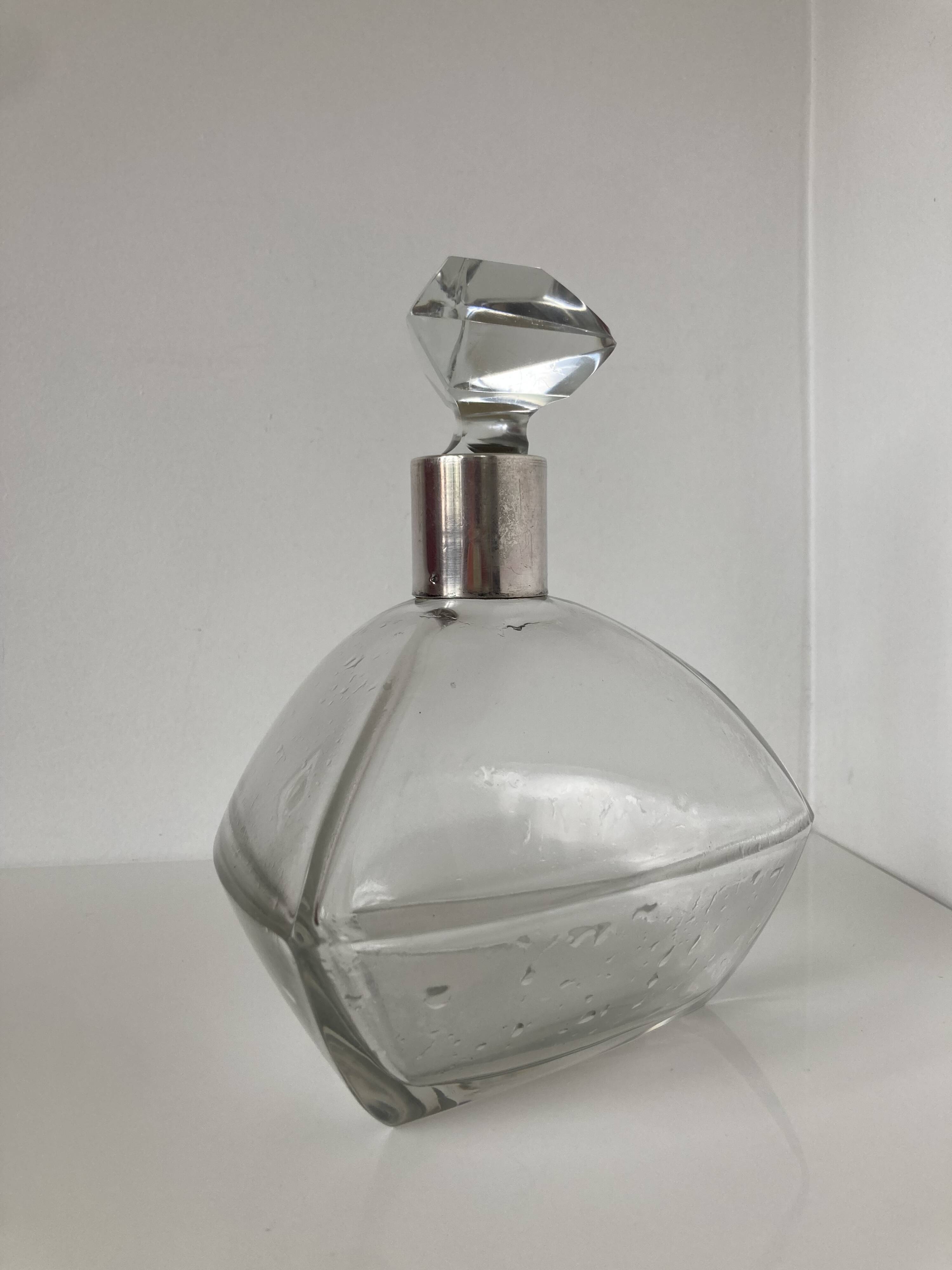 Beautiful cut crystal carafe with its stopper and solid silver setting