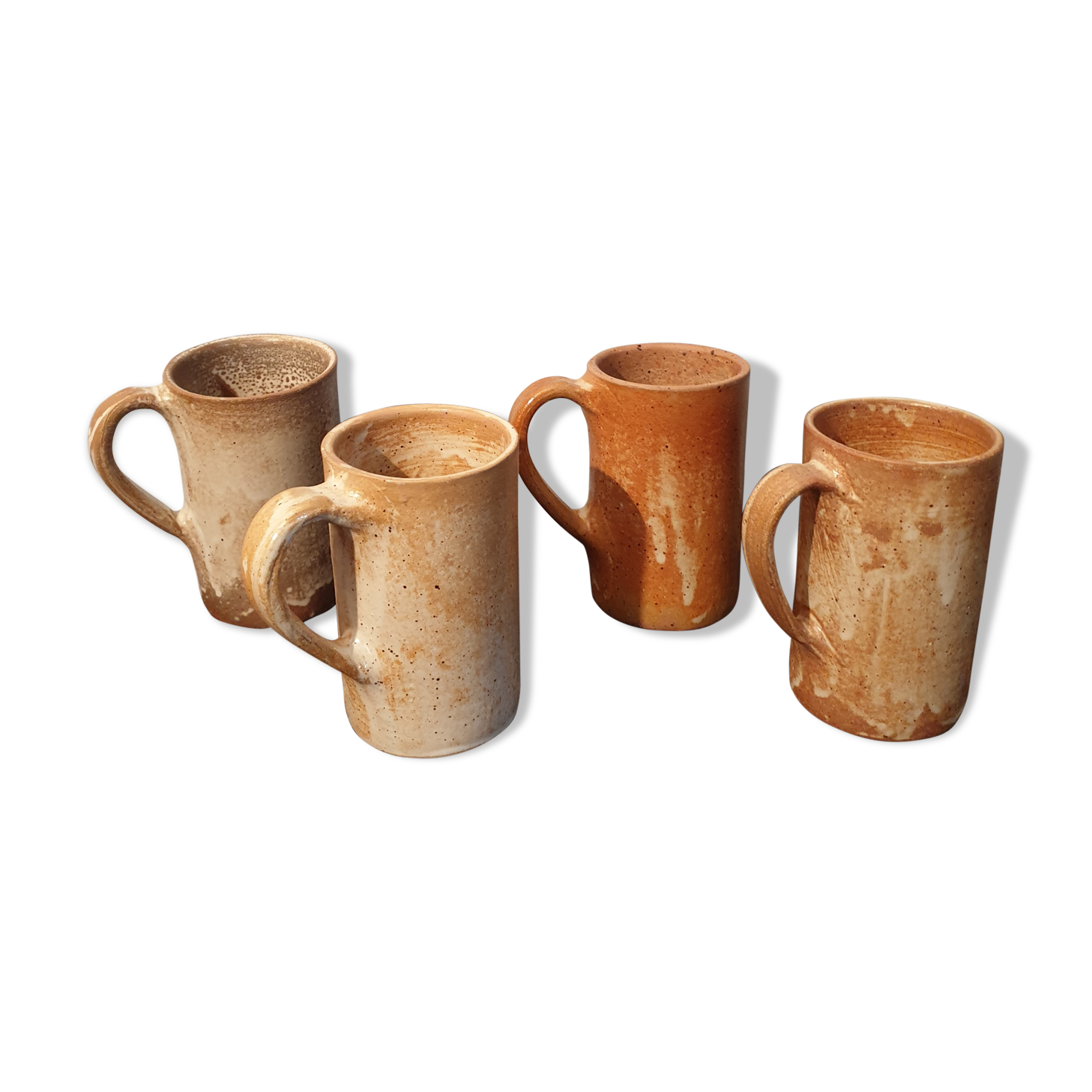Suite of 4 sandstone mugs