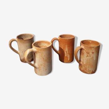 Suite of 4 sandstone mugs