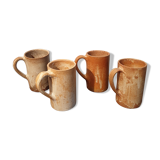 Suite of 4 sandstone mugs