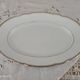 Oval plate in white Swiss porcelain double gilded border "VSK USC Viribus Unitis"