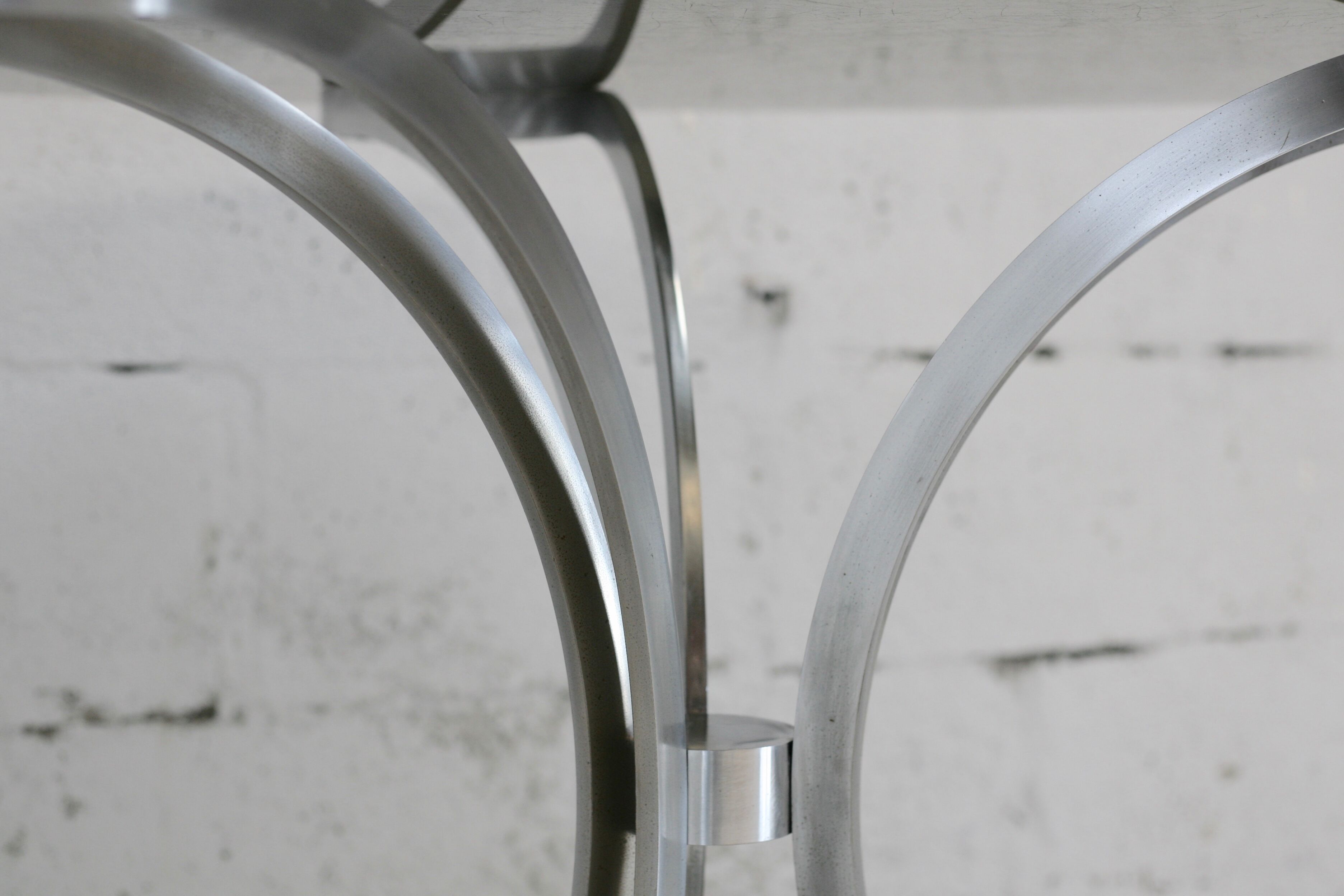 Living room table "Space Age" polished steel, circular slab smoked glass. France, circa 1970.