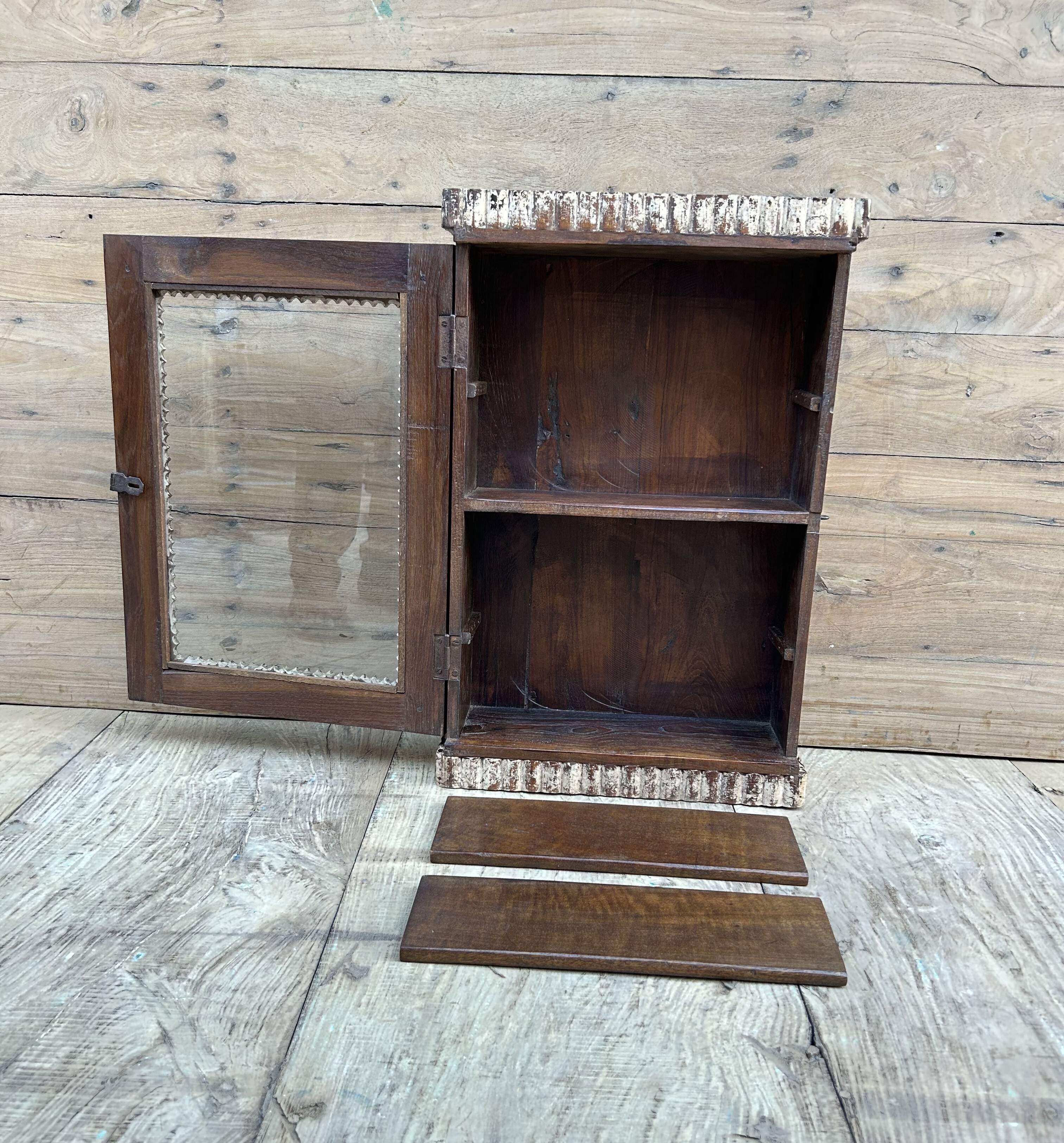 Art Deco wall display cabinet in Burmese teak with original patina.