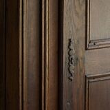 Tall antique oak wardrobe, made by a French cabinetmaker, late 19th century.