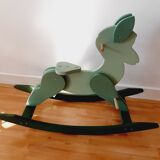 Cheval de bois à bascule