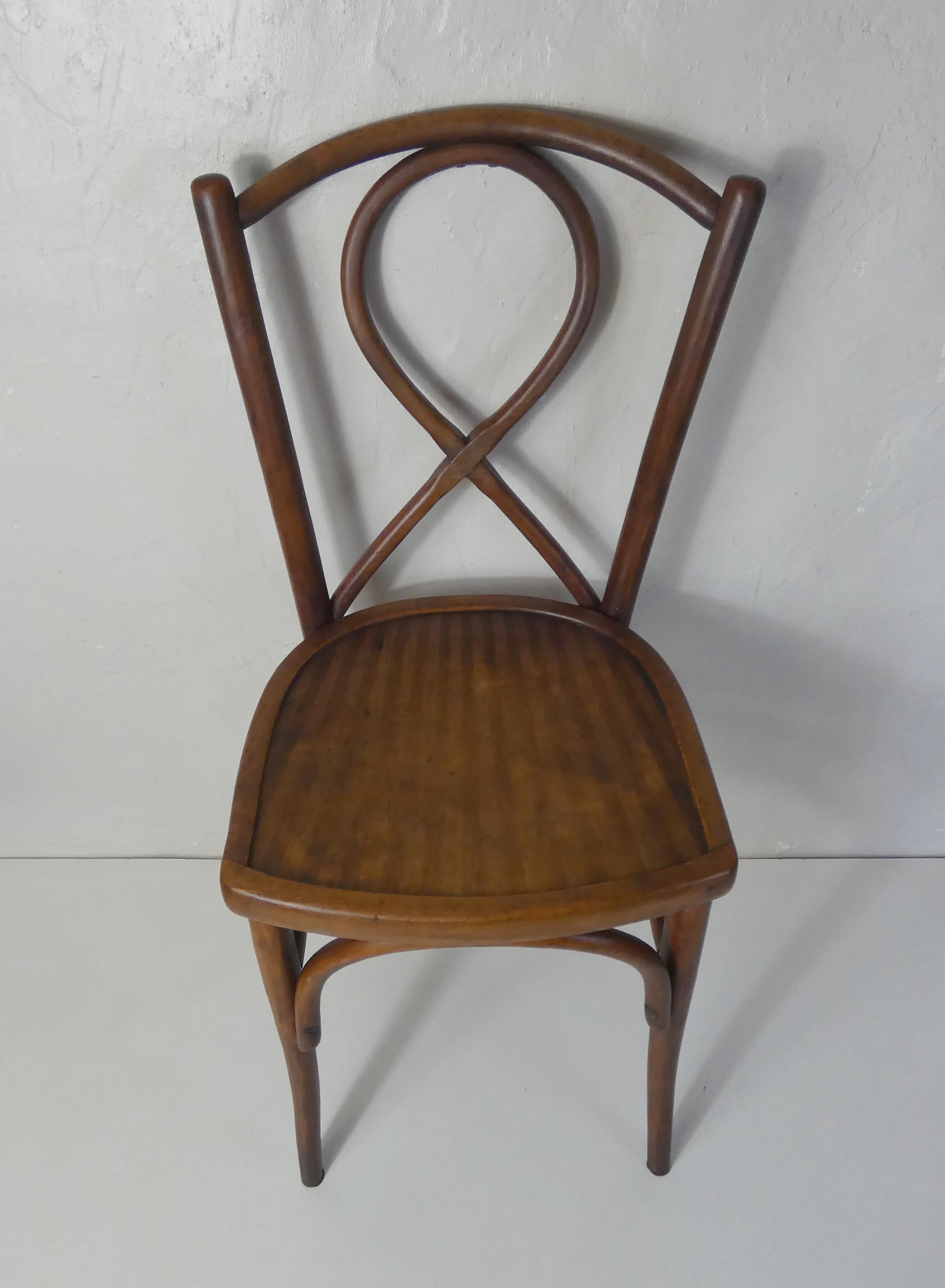 Old curved wooden bistro chair