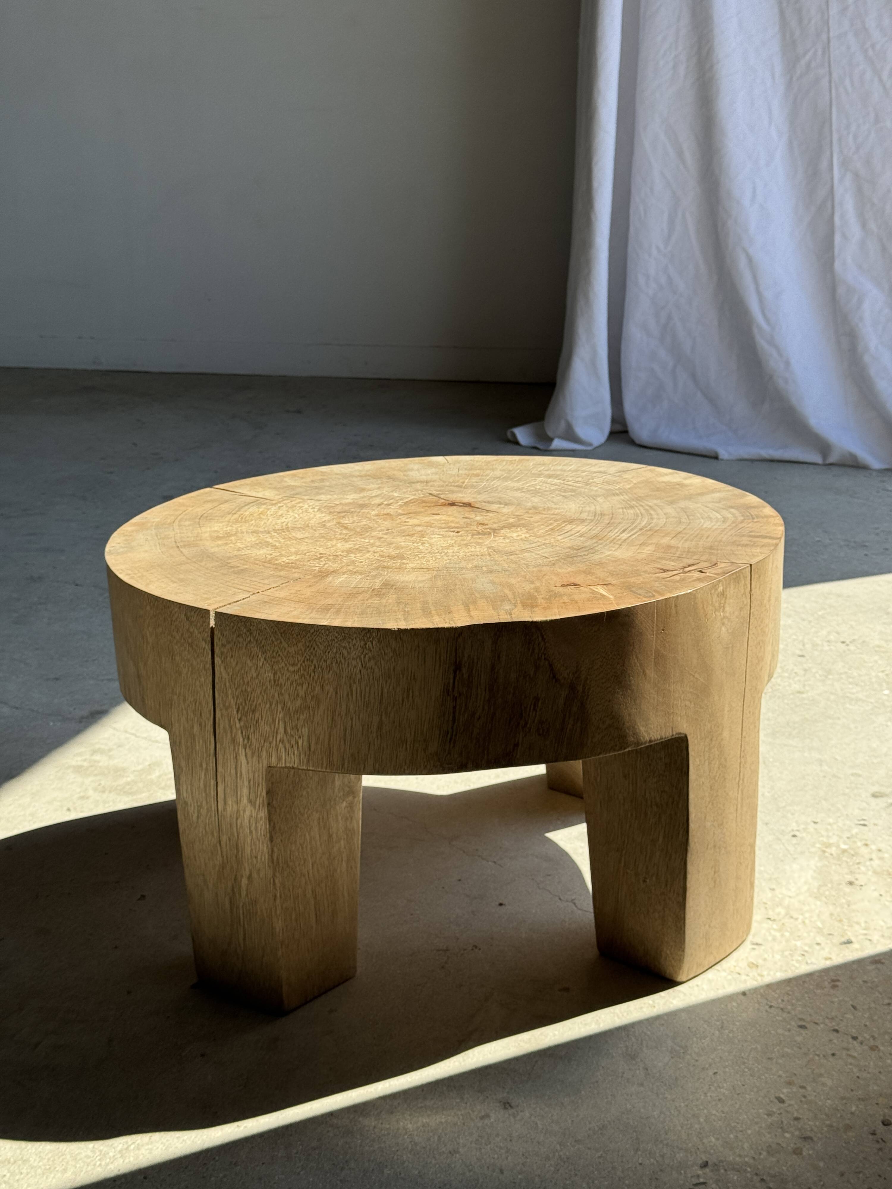 Coffee table, four-legged low table in natural solid monoxyle mango wood.