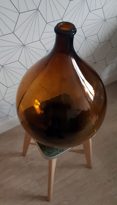 Great old demijohn in amber glass