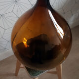 Great old demijohn in amber glass