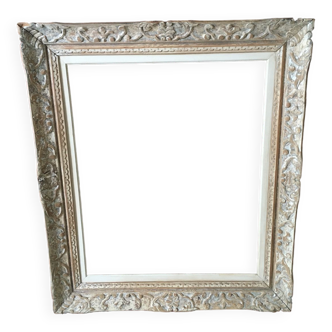 Carved wood frame.