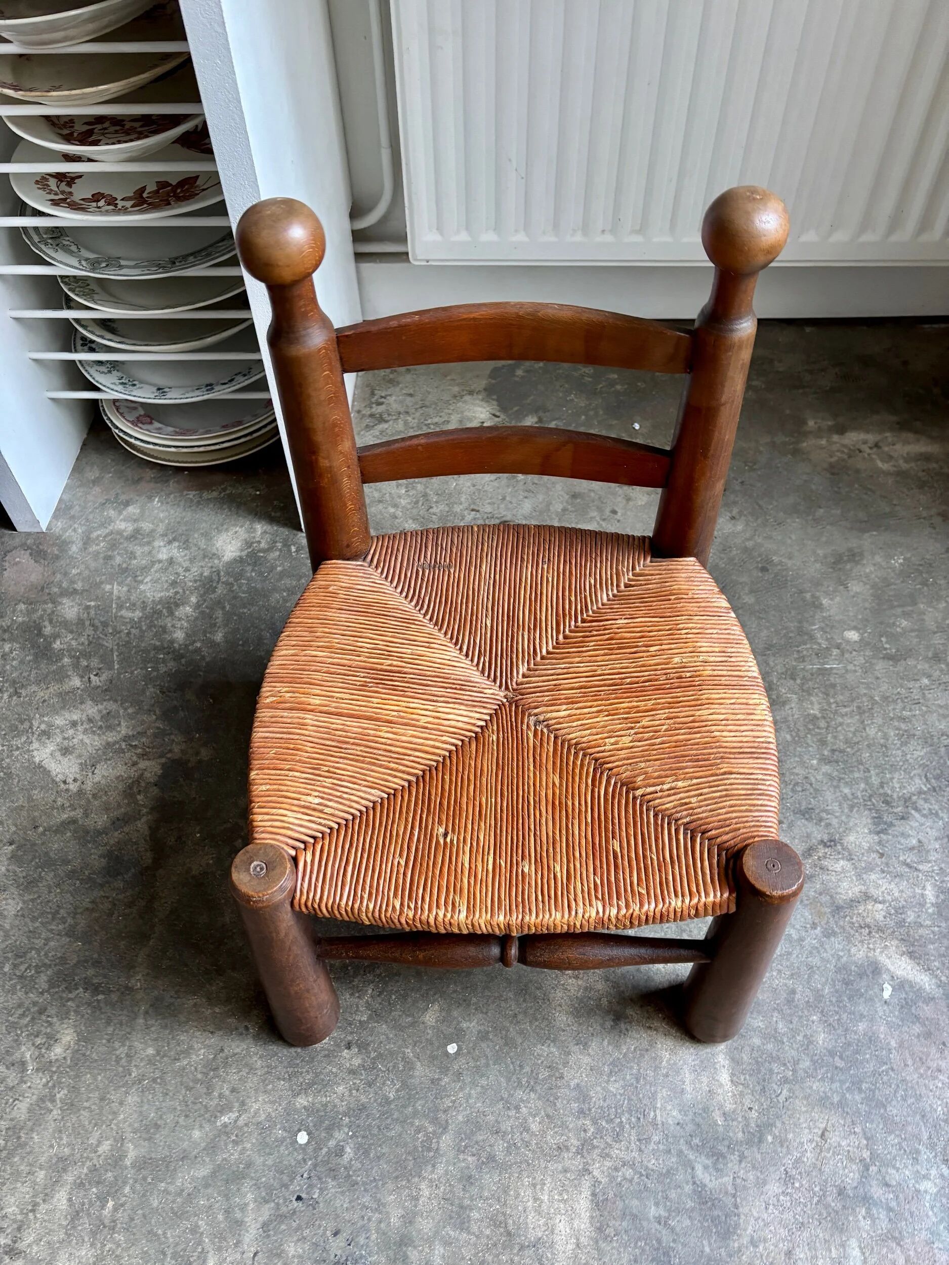 Brutalist low chair in dark wood and straw no. 2