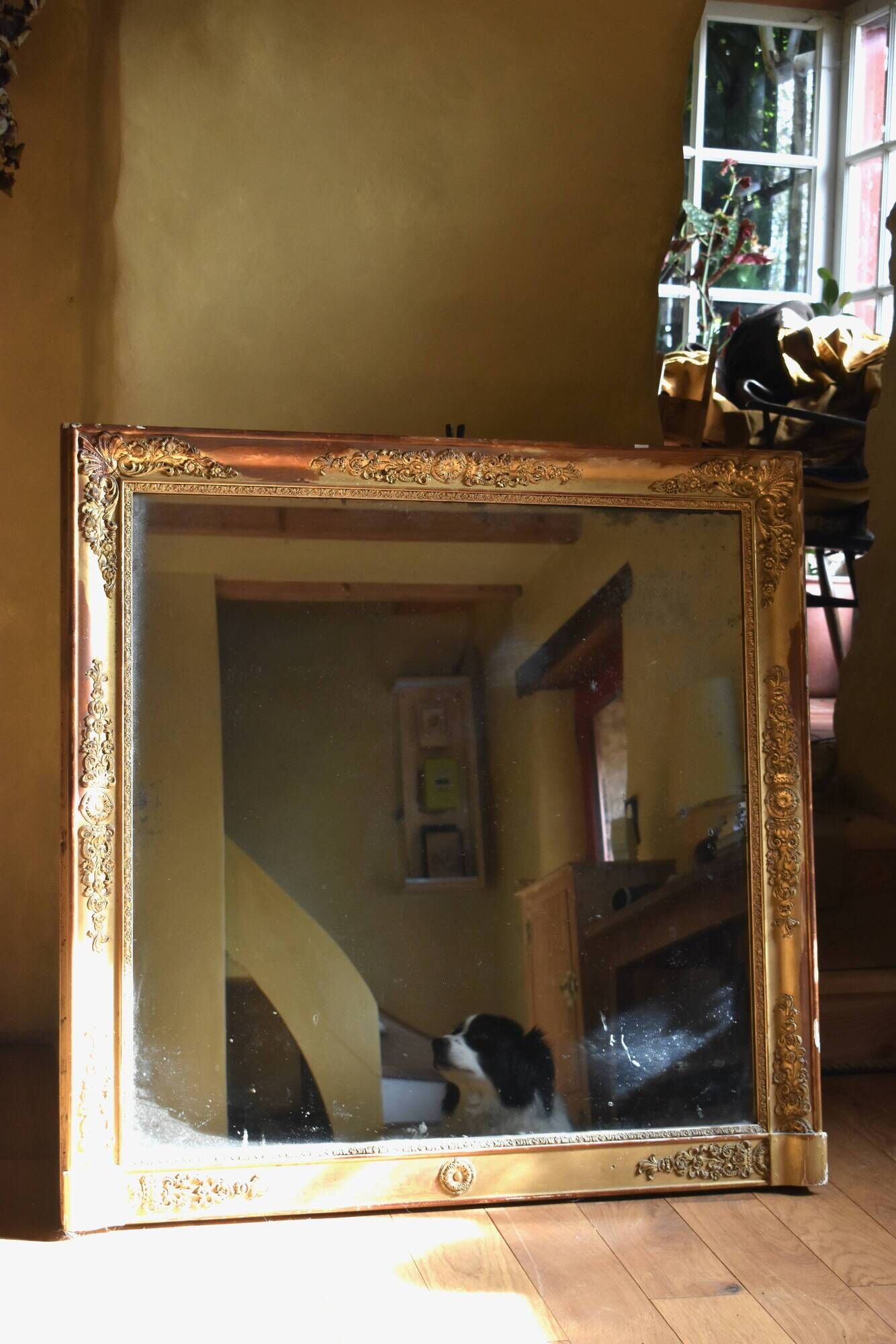 Large gilded Empire mirror from the 19th century.