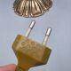 Hollywood Regency bedside lamp in gold metal with a glass globe.