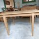 Oak dining table with a checkerboard top and extensions.