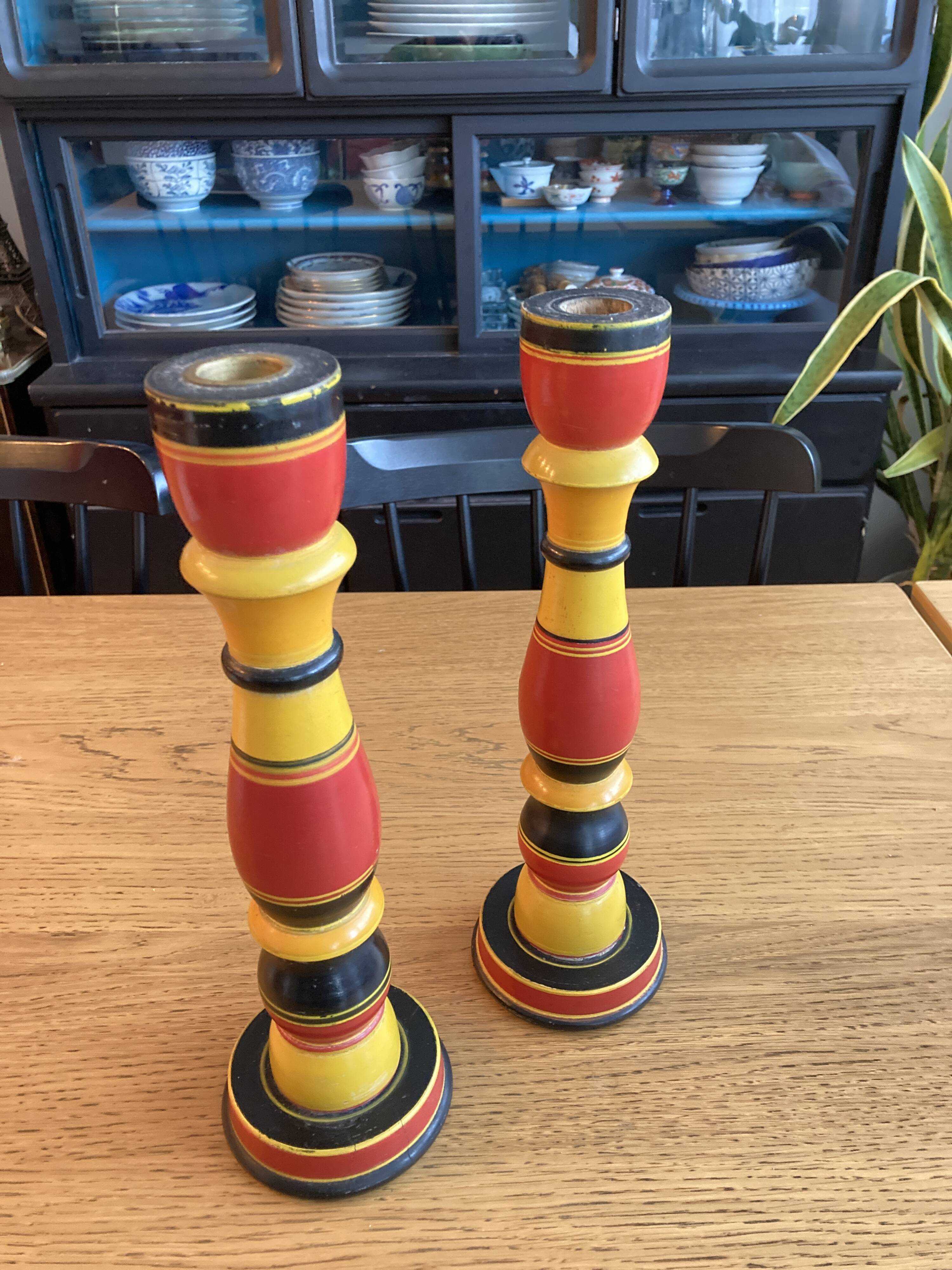 Polychrome turned wooden candlesticks