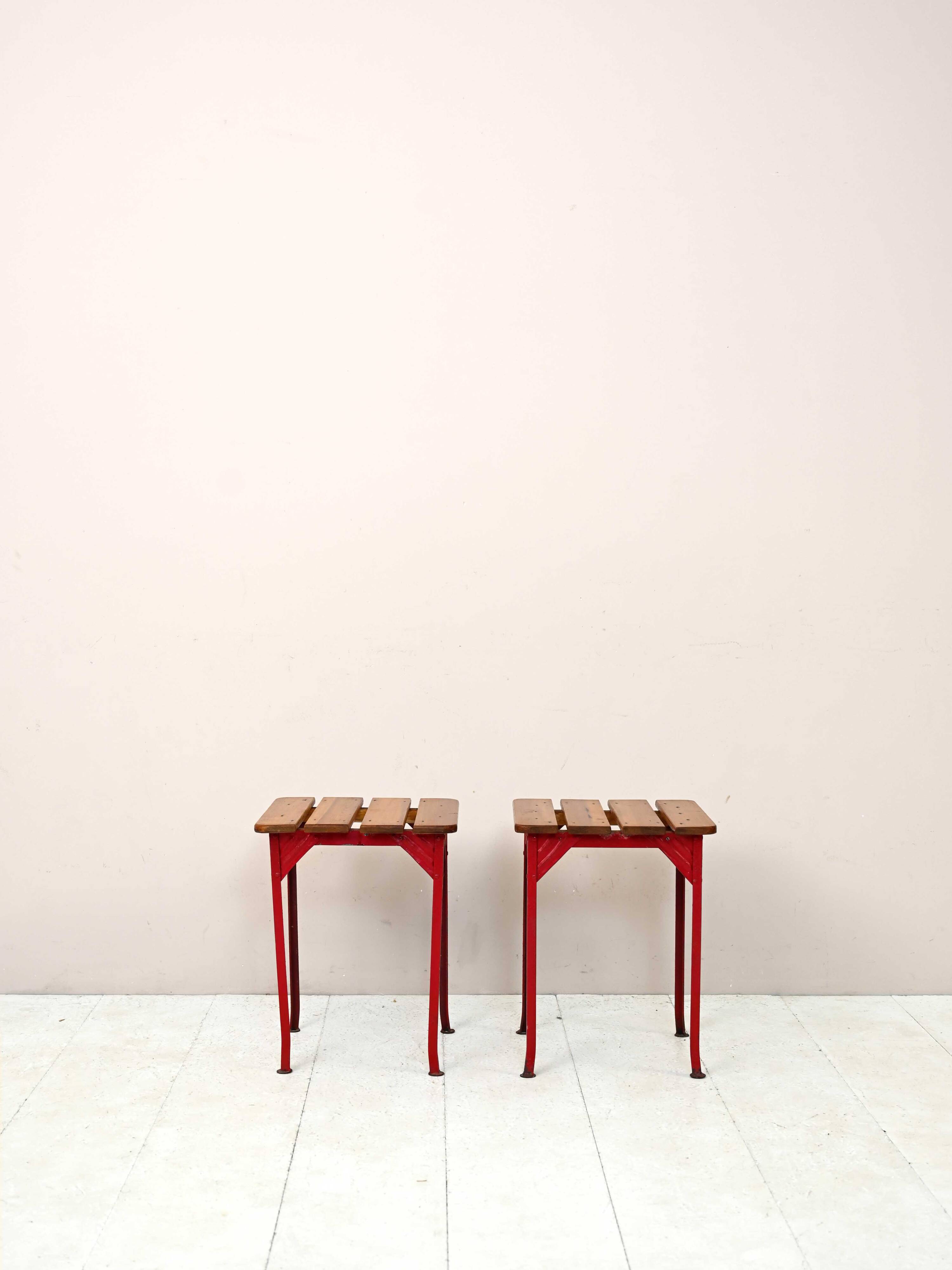 Pair of red metal and wood stools