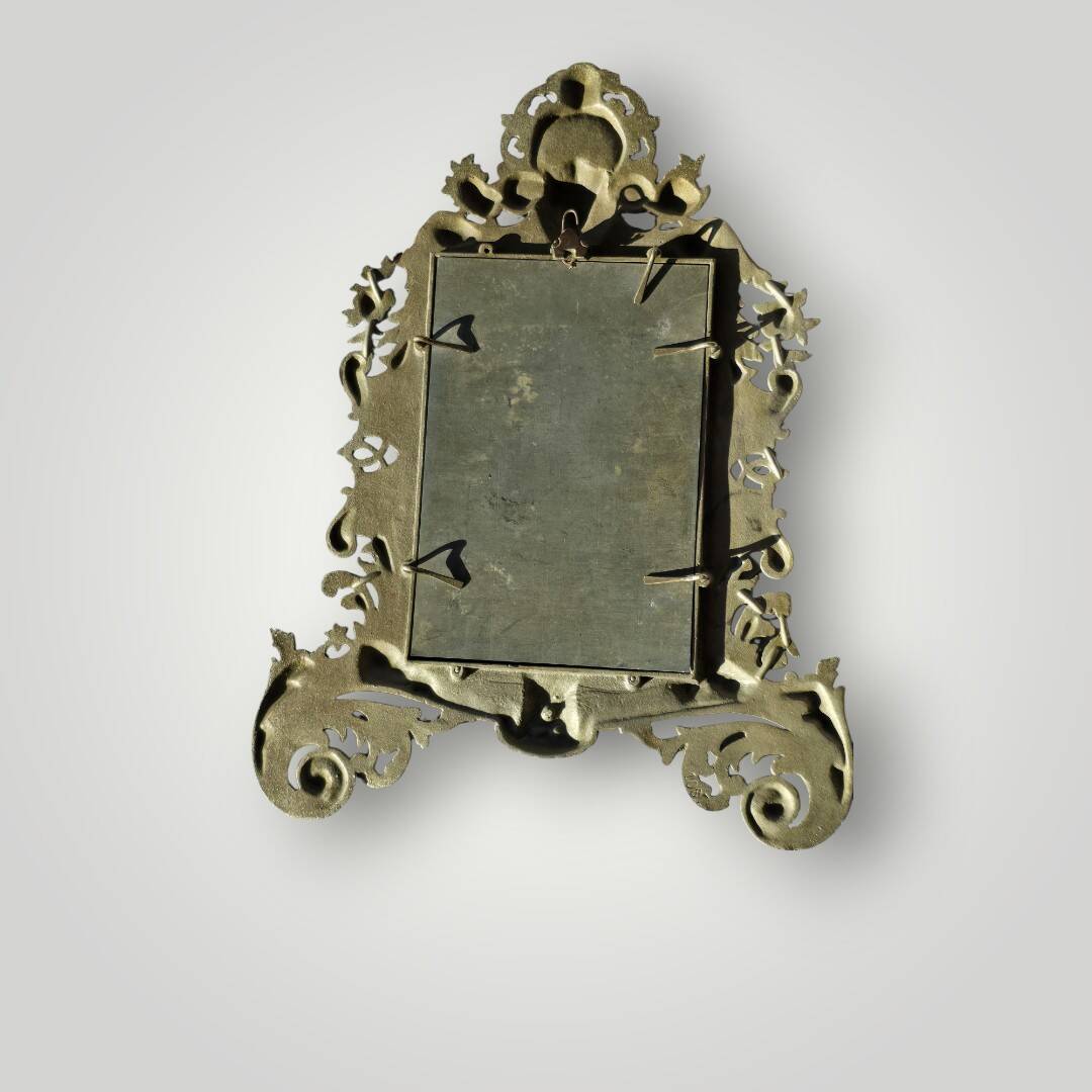 Gilded bronze wall mirror, beveled glass