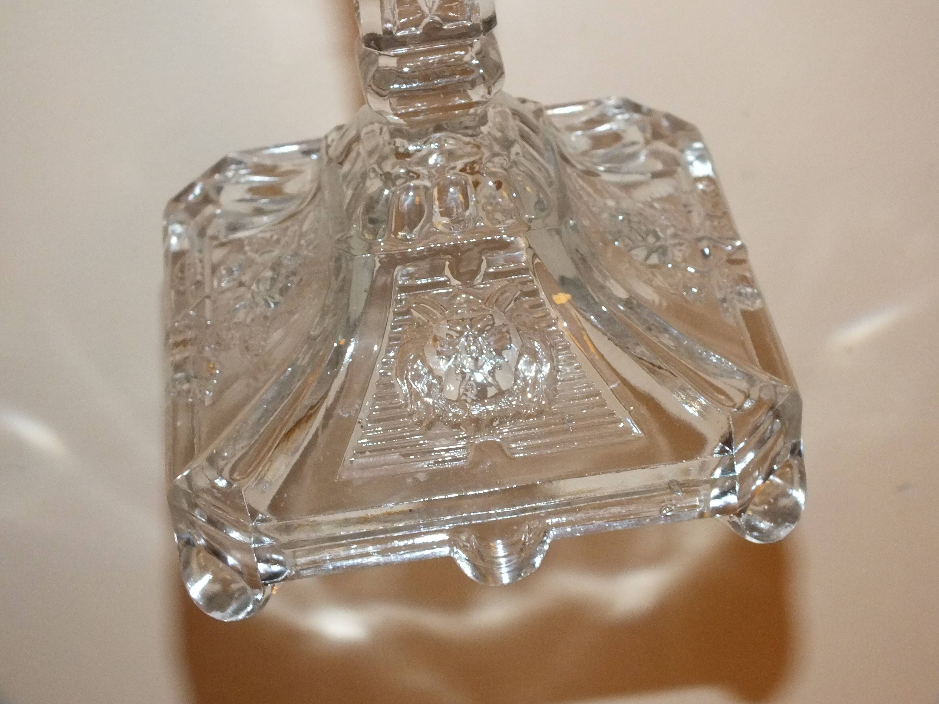 19th century candlestick in molded glass decorated with roses and lions