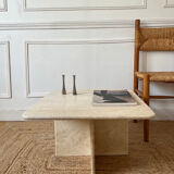 Square coffee table in travertine.